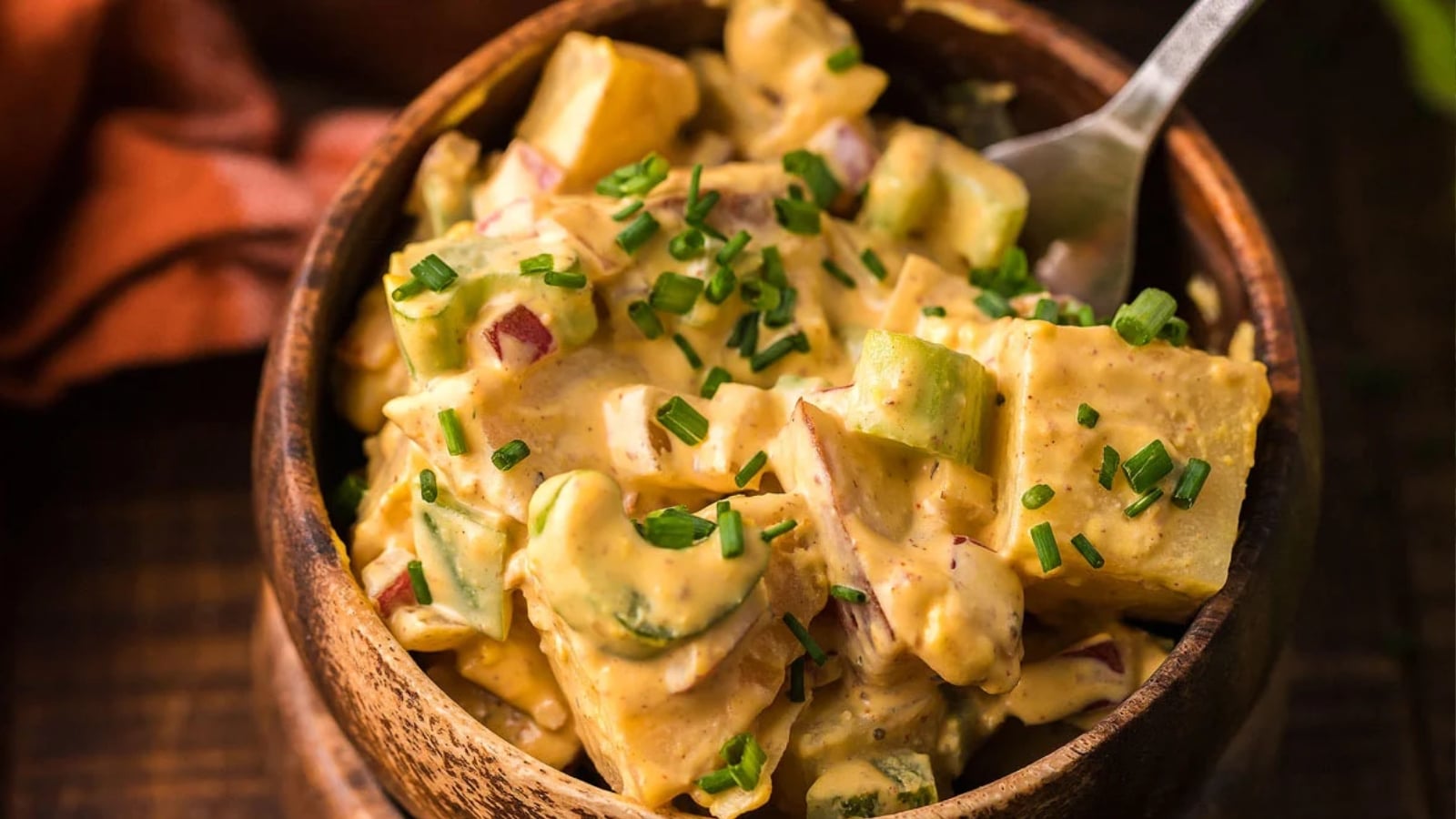 Smoked potato salad with bacon served in a bowl.