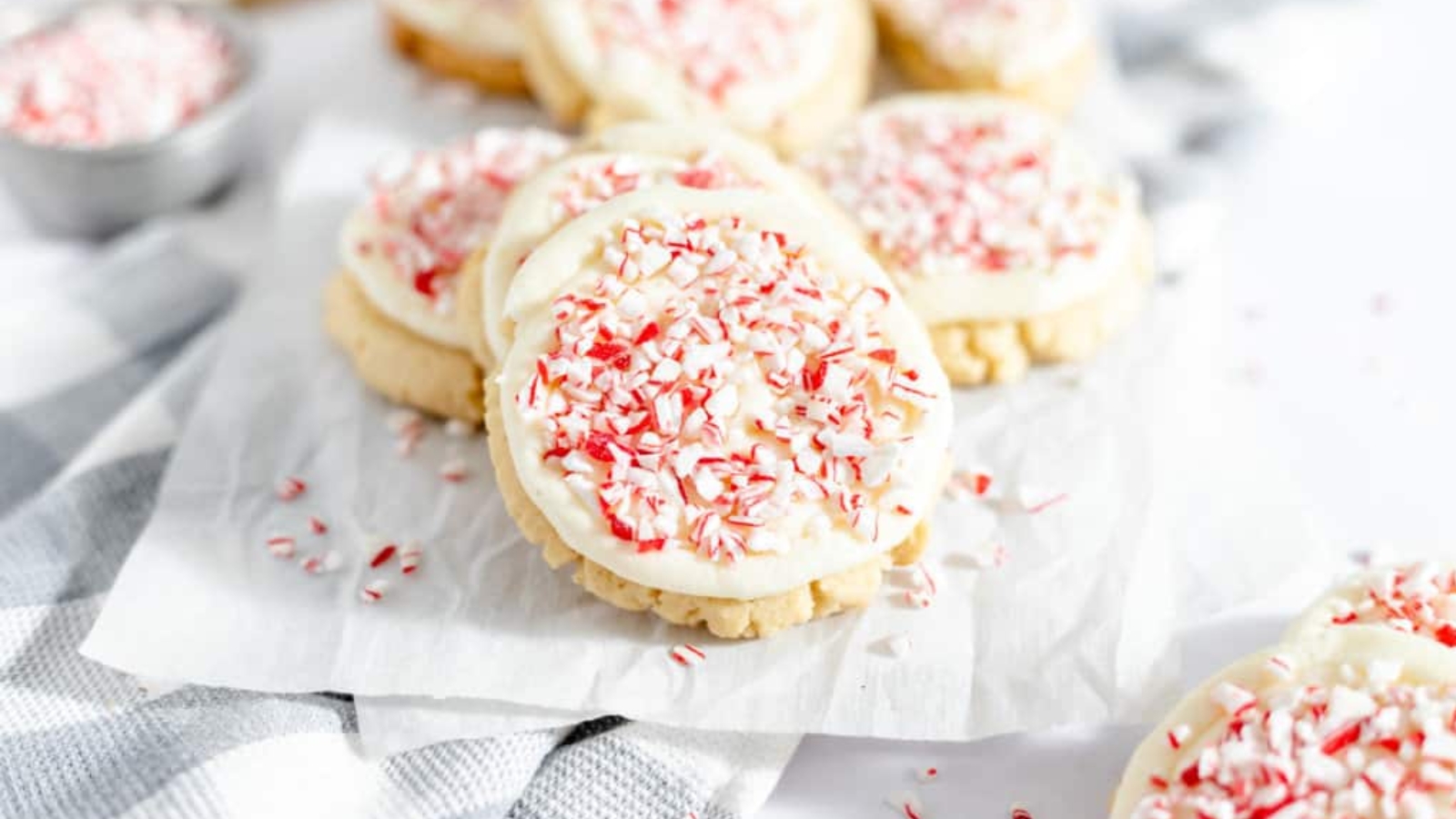 Peppermint candy cane cookies topped with peppermint frosting and crushed candy canes.