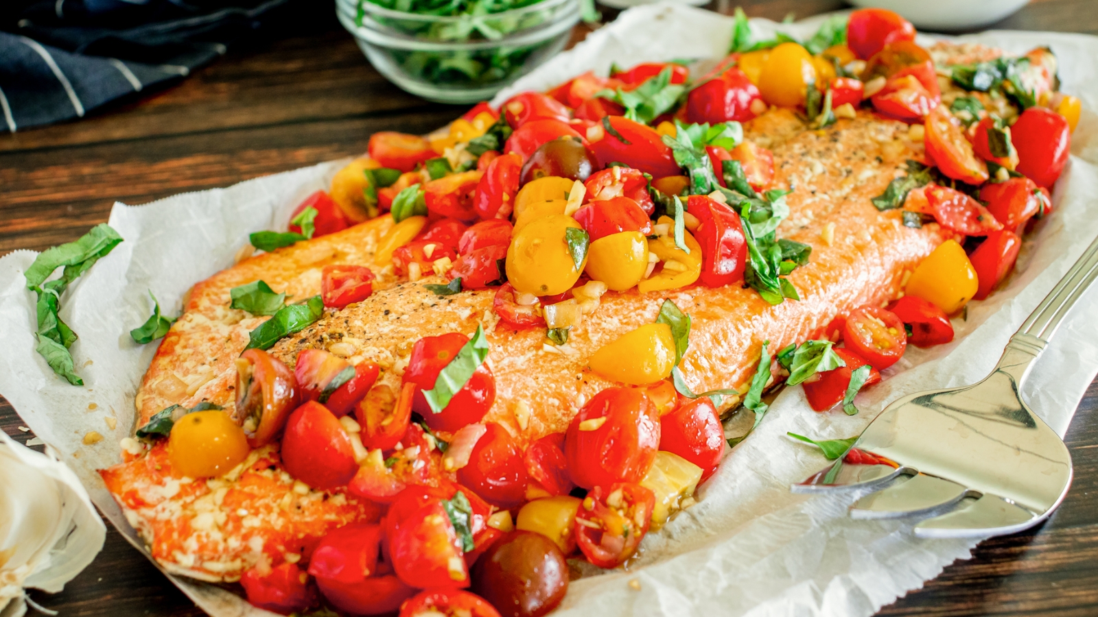 Bruschetta salmon with diced tomatoes and basil piled atop oven-roasted salmon.