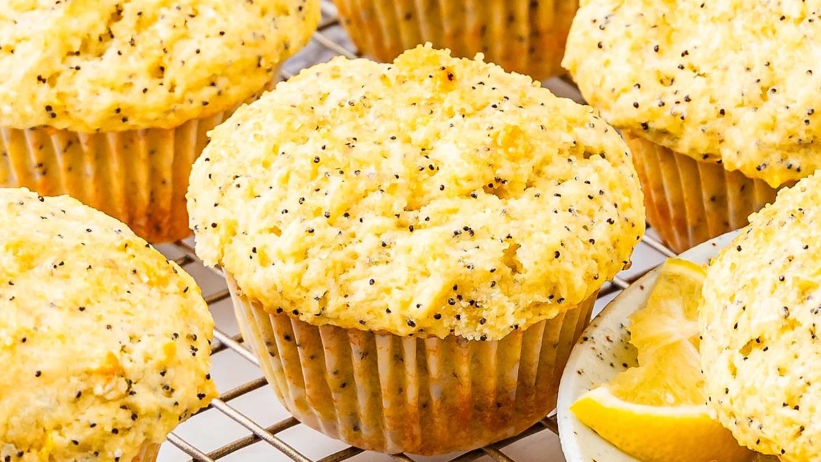Muffin batter bakes with lemon and poppy seeds until the crumb sets light and structured.
