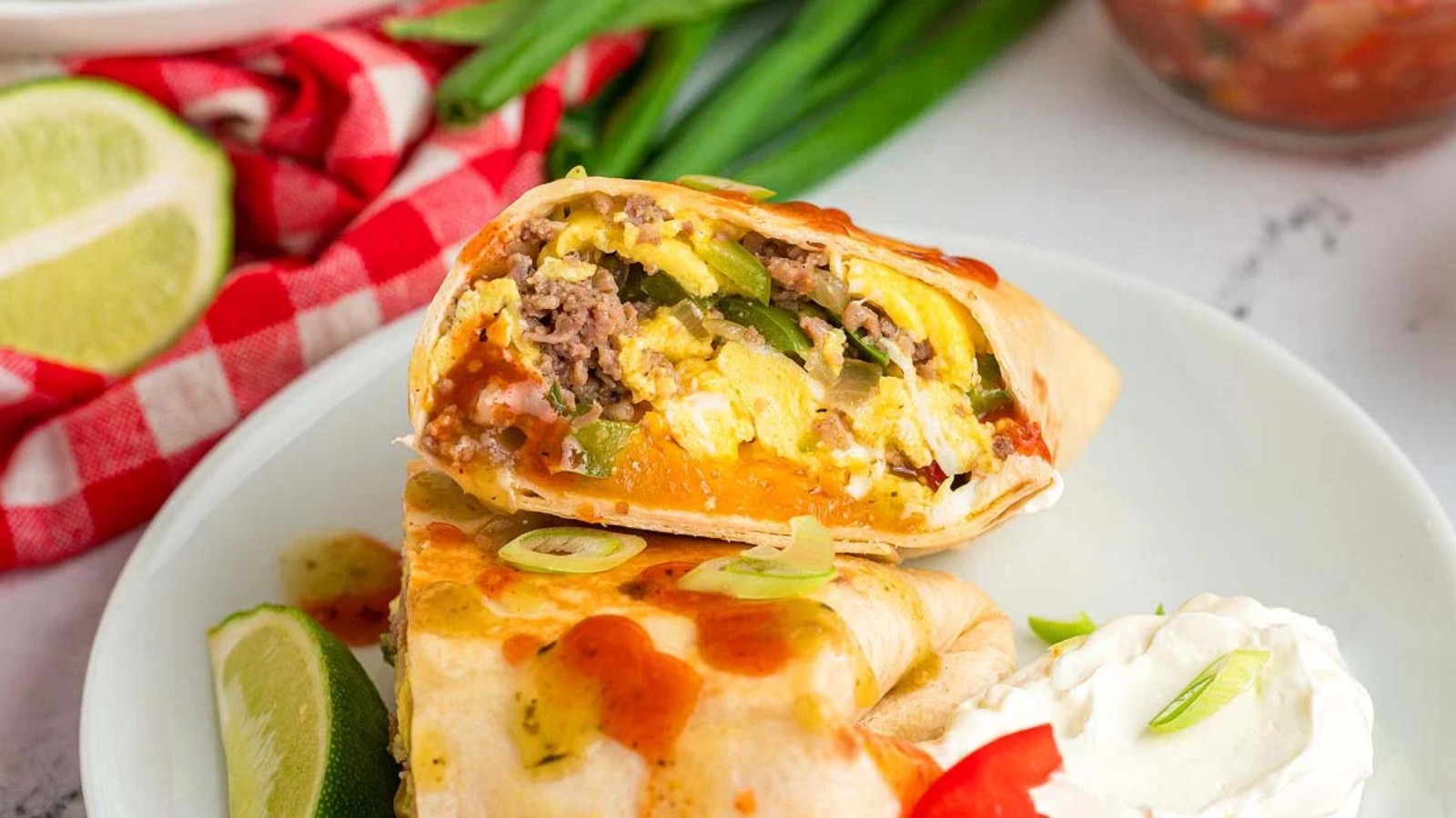 Eggs, sausage, and fillings wrap into tortillas and cook until everything holds together.