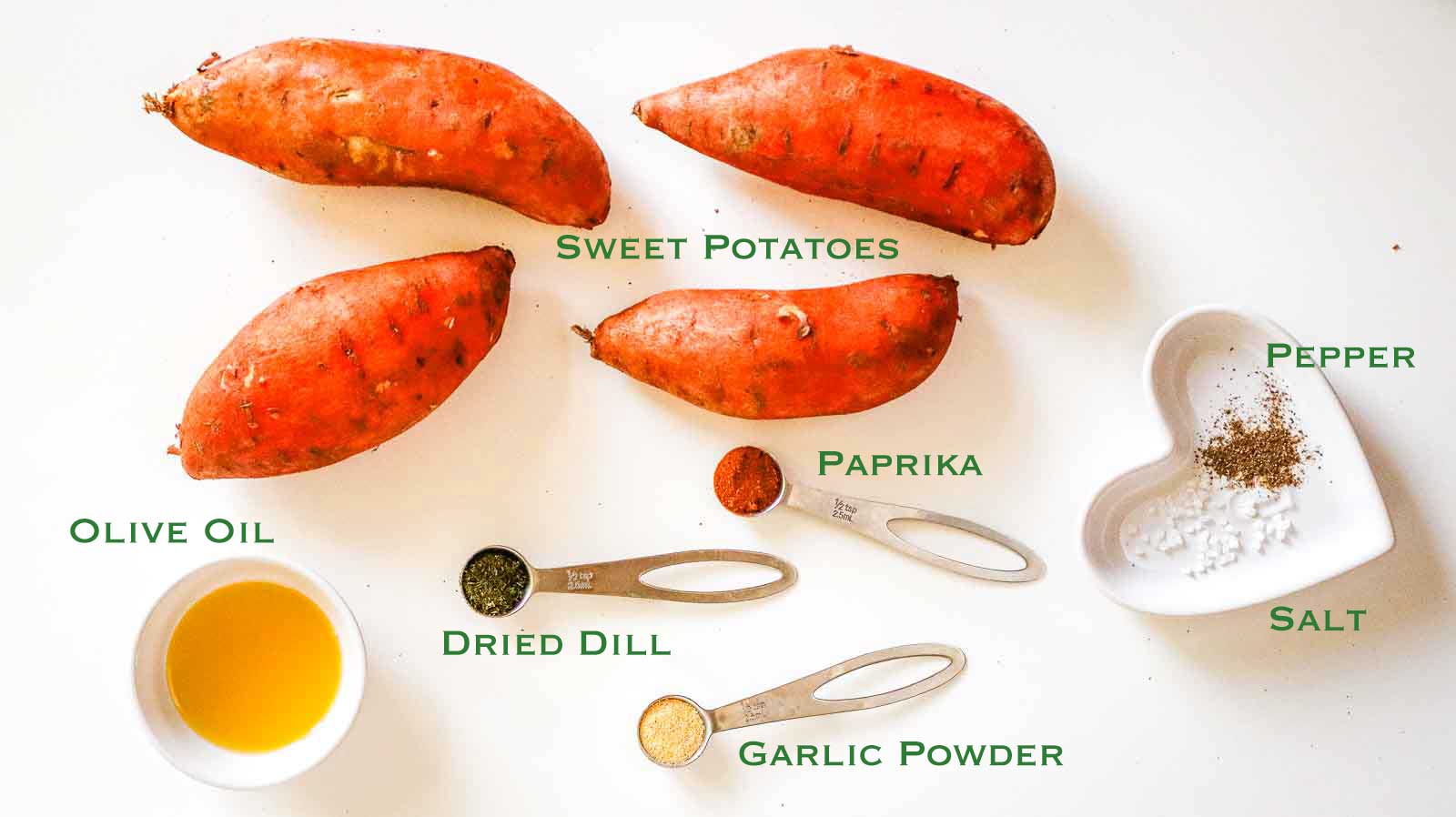 Labeled ingredients for air fryer sweet potato fries: sweet potatoes, olive oil, dried dill, garlic powder, paprika, salt, and pepper.