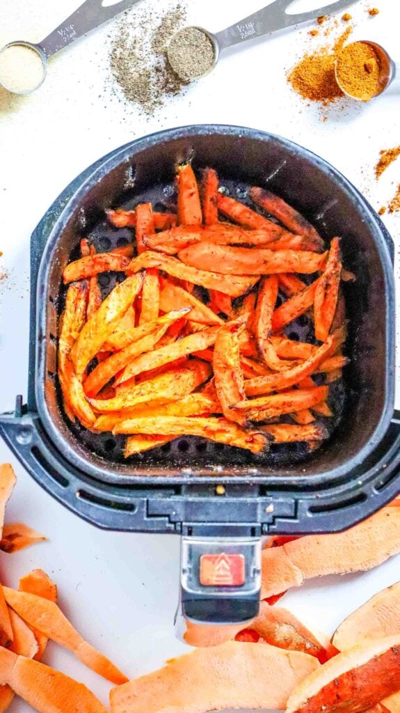 Golden, crispy sweet potato fries cooked in the air fryer basket.